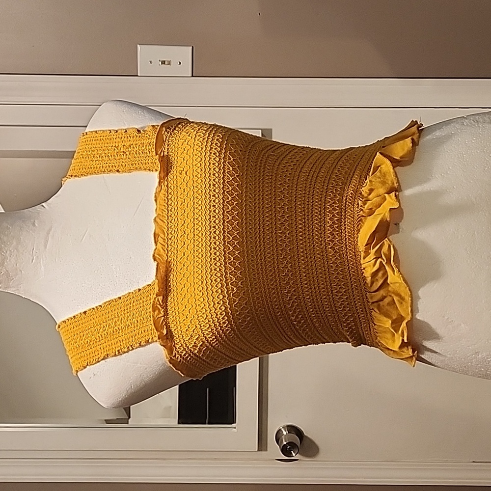 A. Hearts gold smocked crop top